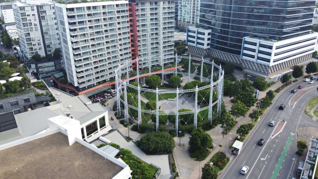 Aerial view of the Gasworks gasometer frame and apartment towers in Newstead